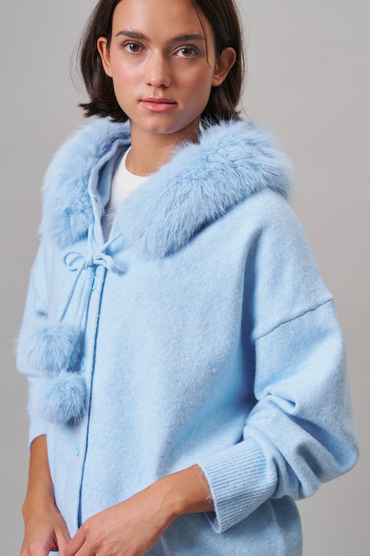 Faux Fur Hood Pom Pom Cardigan Wool Blend in Baby Blue in BLUE - Women's Cardigans & Shrugs | Urban Daizy