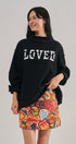 LOVED Varsity Patch Mock Neck Sweatshirt with Exposed Seams in BLACK - Women's Sweatshirts & Hoodies | Urban Daizy
