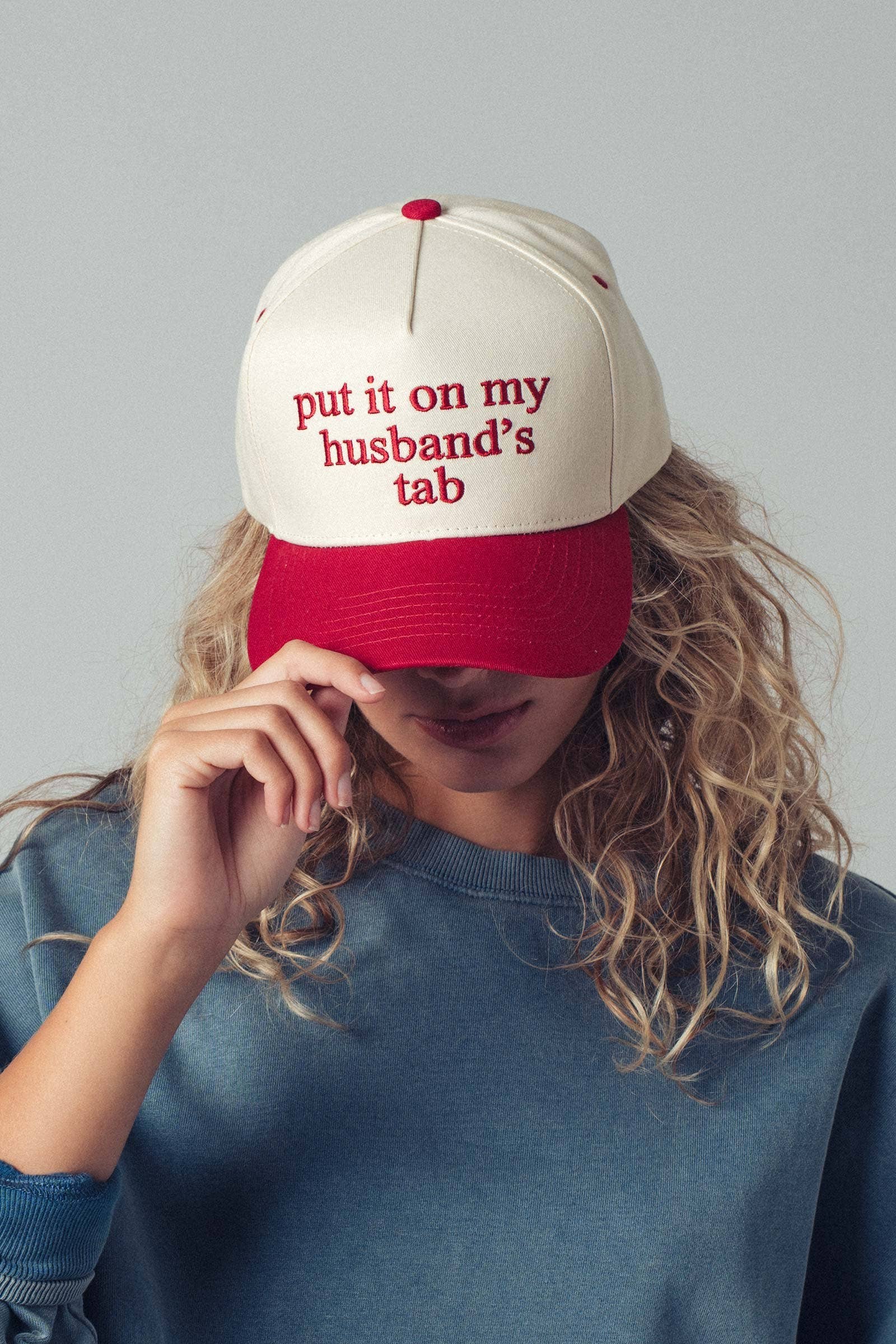 Put It On My Husbands Tab Trucker Hat