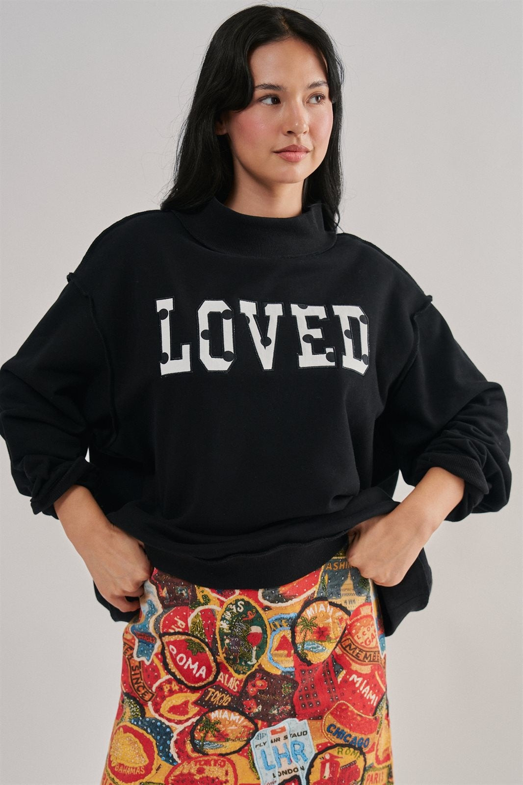 LOVED Varsity Patch Mock Neck Sweatshirt with Exposed Seams in BLACK - Women's Sweatshirts & Hoodies | Urban Daizy