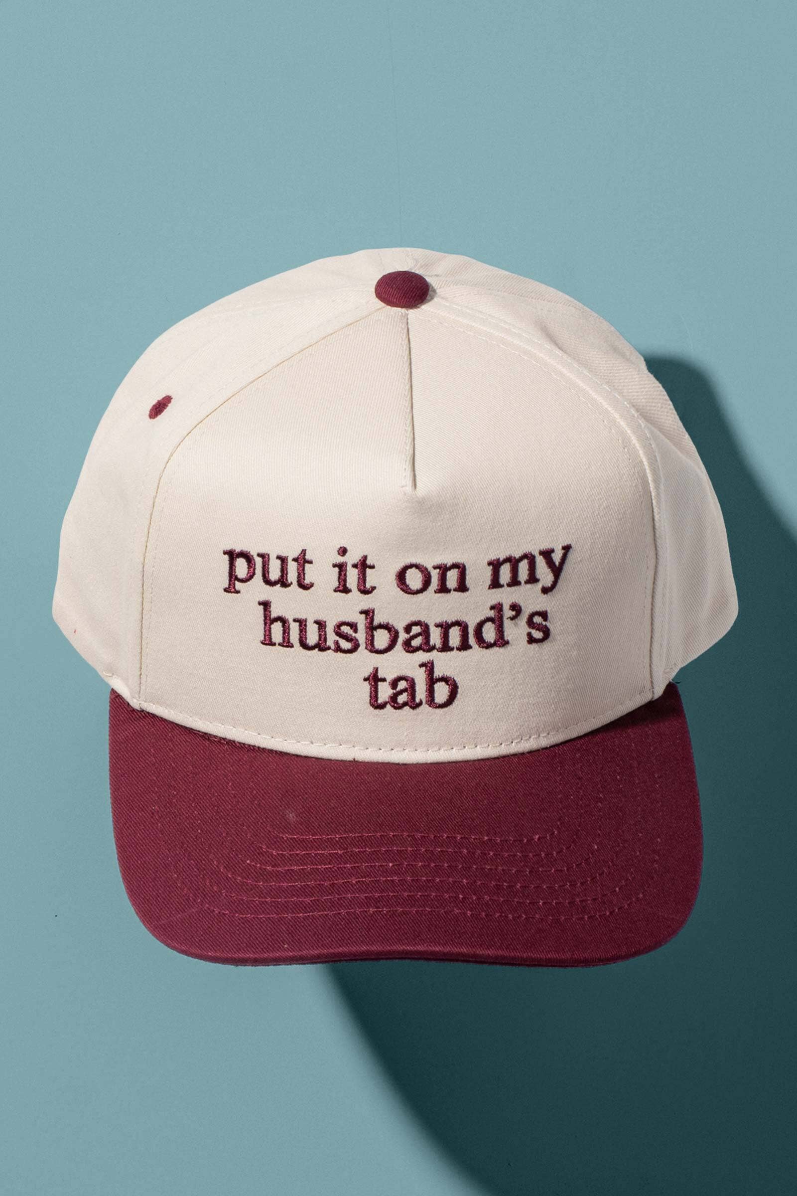 Put It On My Husbands Tab Trucker Hat