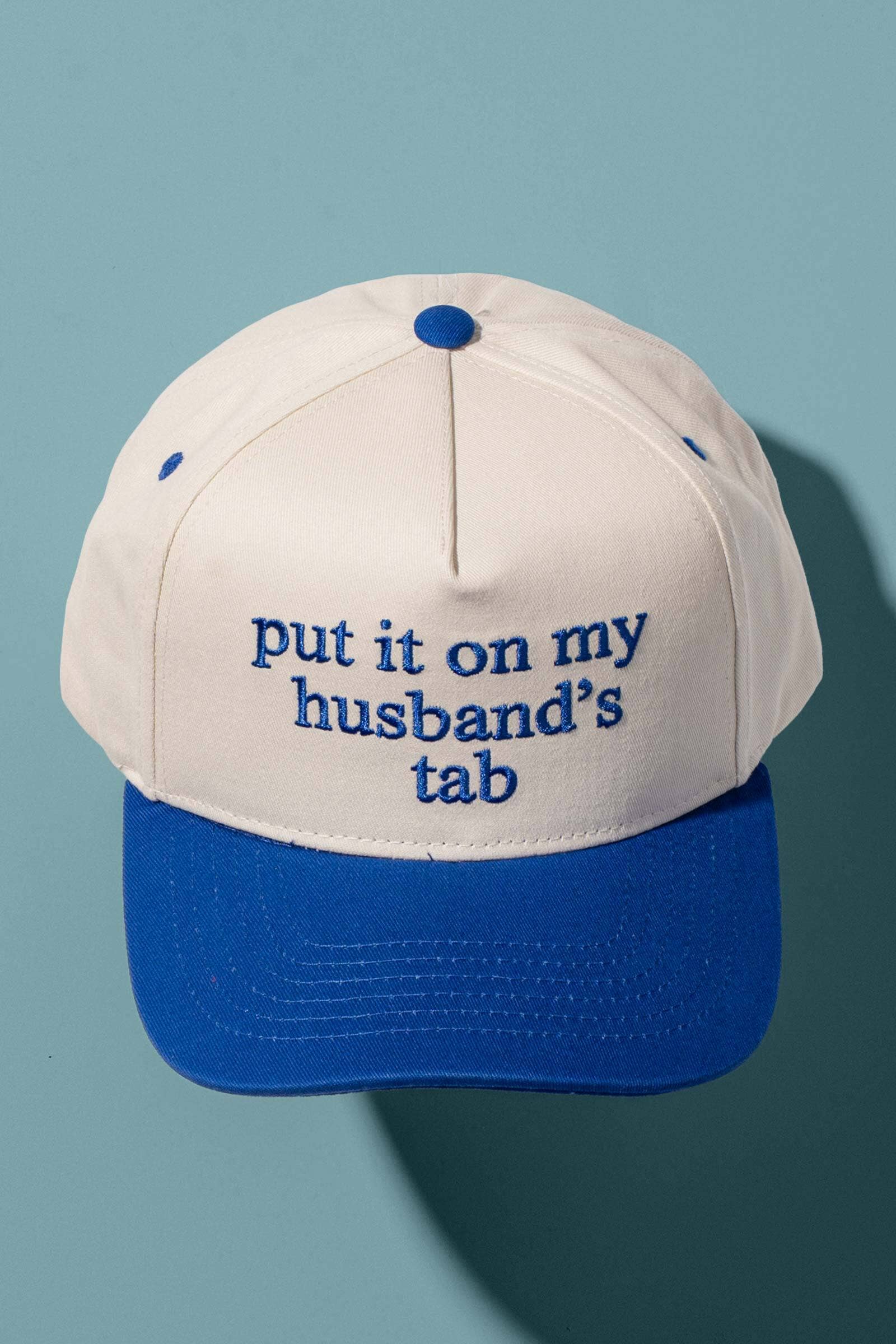 Put It On My Husbands Tab Trucker Hat