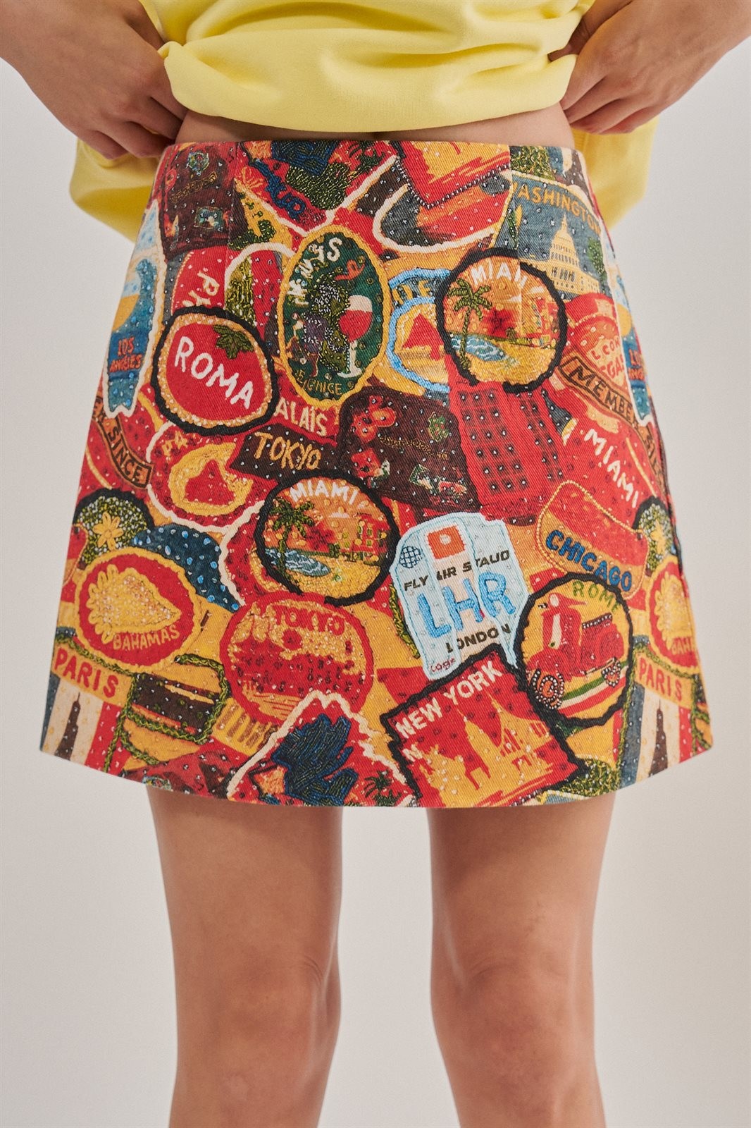 Travel Patch Print Mini Skirt in Italian Summer Vacation in MULTI - Women's Mini Skirts | Urban Daizy