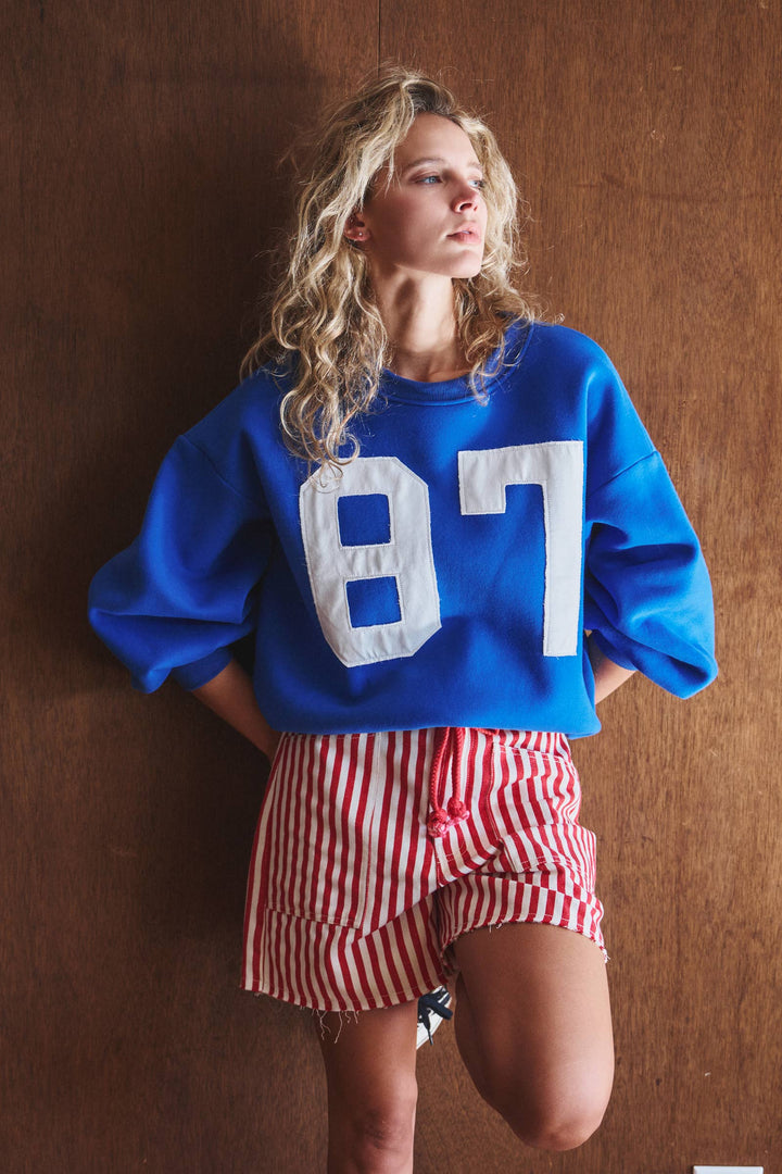 "87" Graphic Balloon Sleeve Oversized Sweatshirt | wholesale graphic sweatshirt - women's | Urban Daizy
