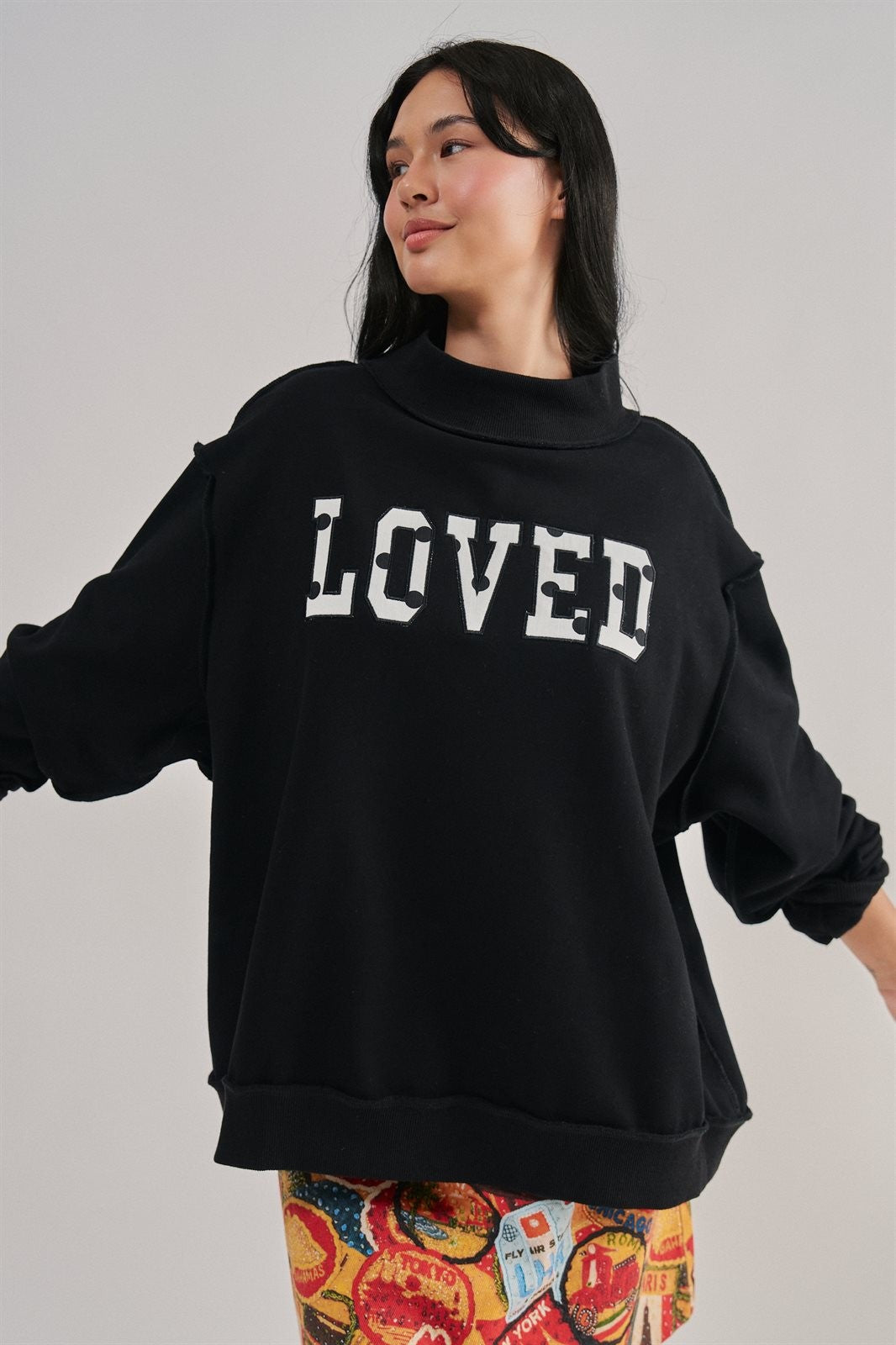 LOVED Varsity Patch Mock Neck Sweatshirt with Exposed Seams in BLACK - Women's Sweatshirts & Hoodies | Urban Daizy