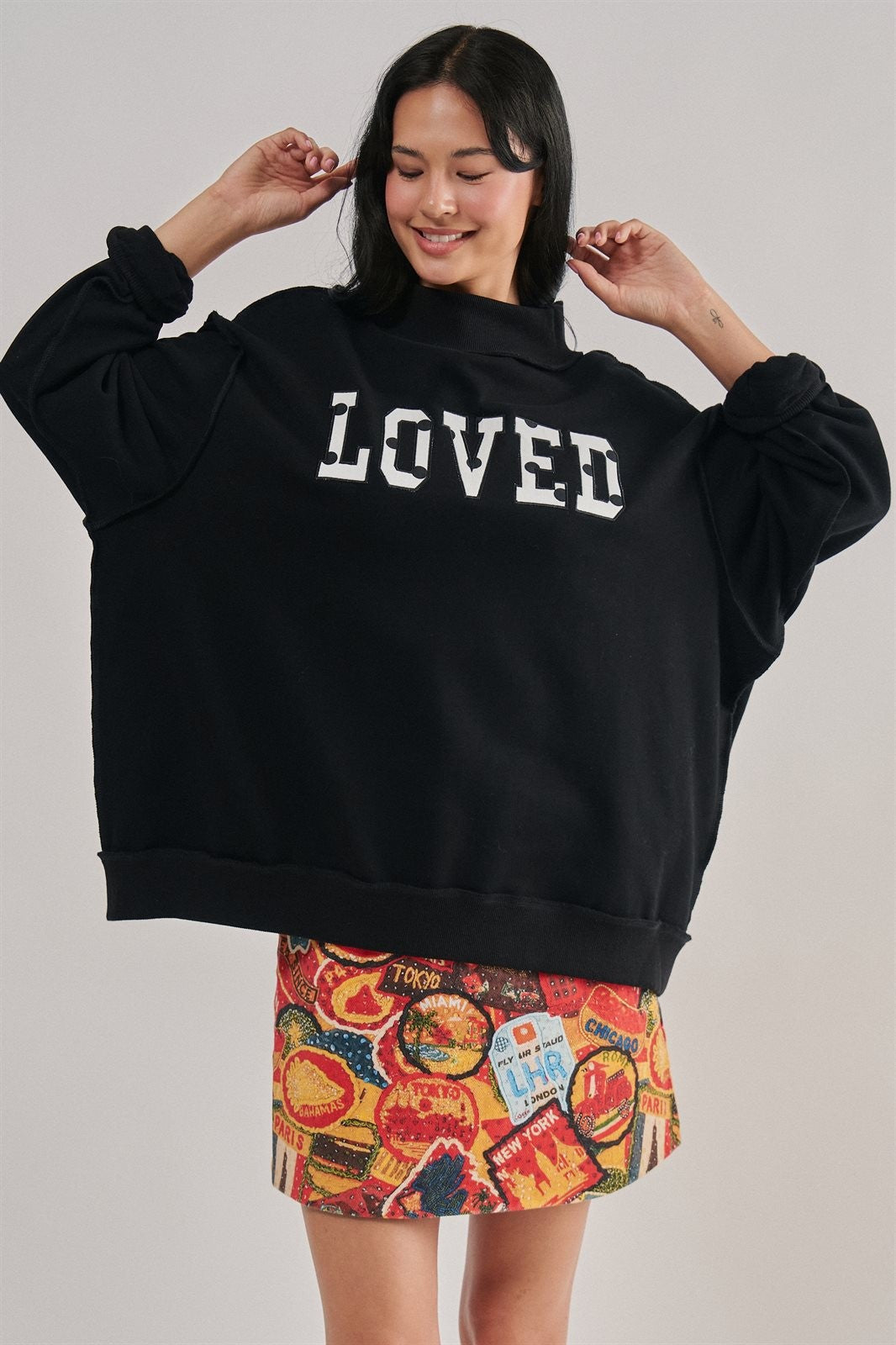 LOVED Varsity Patch Mock Neck Sweatshirt with Exposed Seams in BLACK - Women's Sweatshirts & Hoodies | Urban Daizy