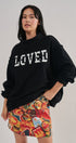 LOVED Varsity Patch Mock Neck Sweatshirt with Exposed Seams in BLACK - Women's Sweatshirts & Hoodies | Urban Daizy
