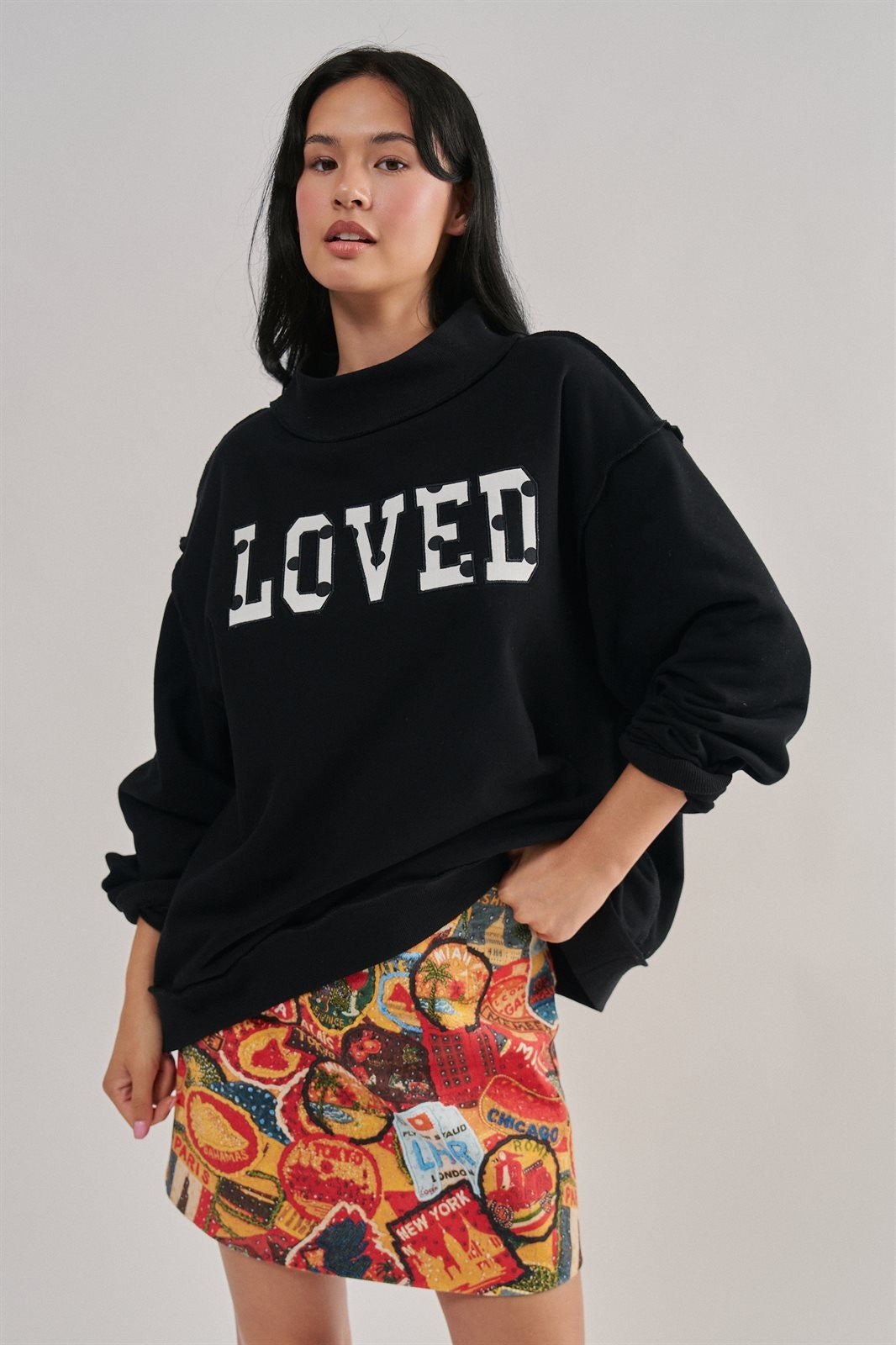 LOVED Varsity Patch Mock Neck Sweatshirt with Exposed Seams in BLACK - Women's Sweatshirts & Hoodies | Urban Daizy