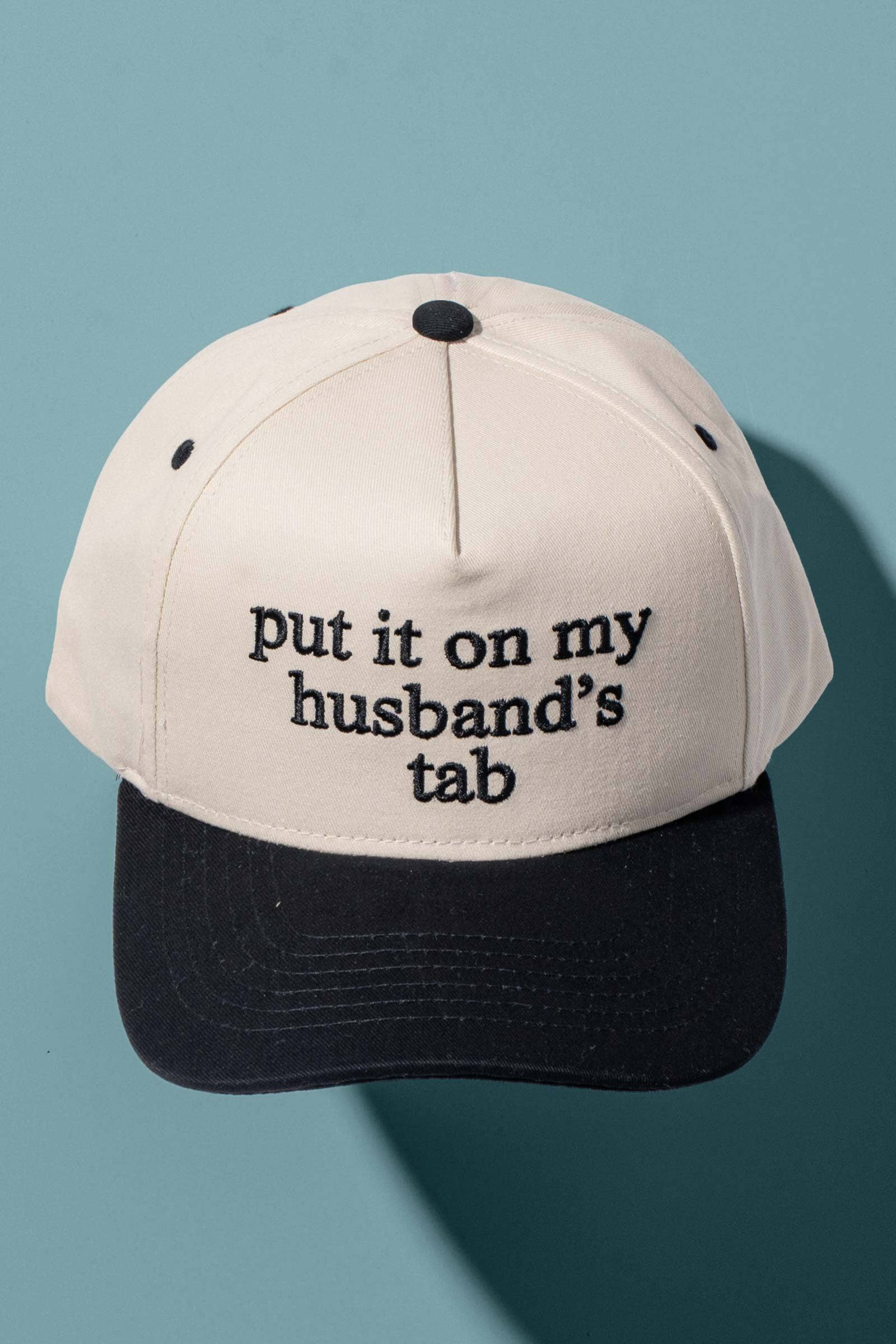 Put It On My Husbands Tab Trucker Hat