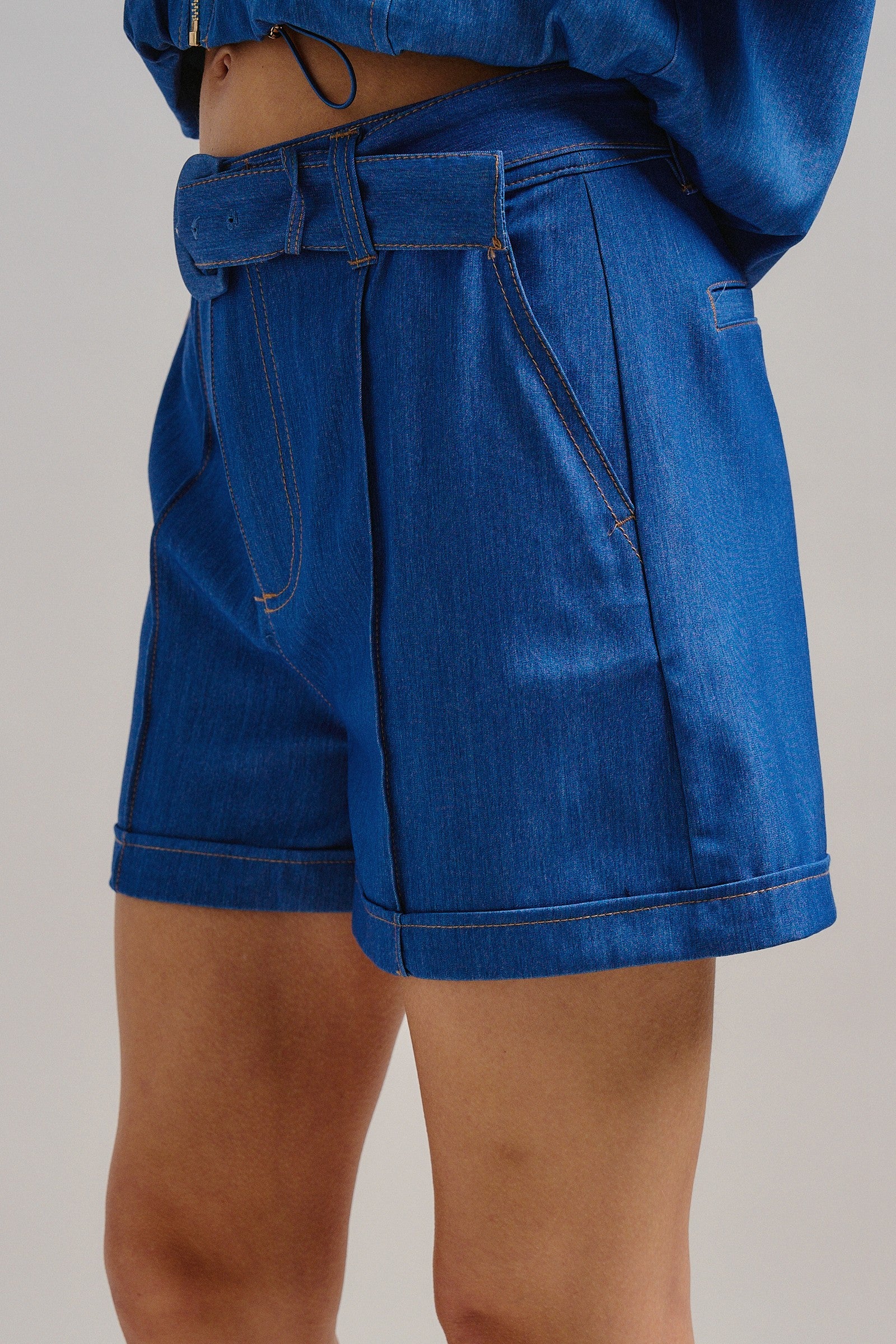 High Waisted Chambray Belted Shorts With Cuffed Hem in Blue - Women's Pants | Urban Daizy