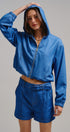 High Waisted Chambray Belted Shorts With Cuffed Hem in Blue - Women's Pants | Urban Daizy