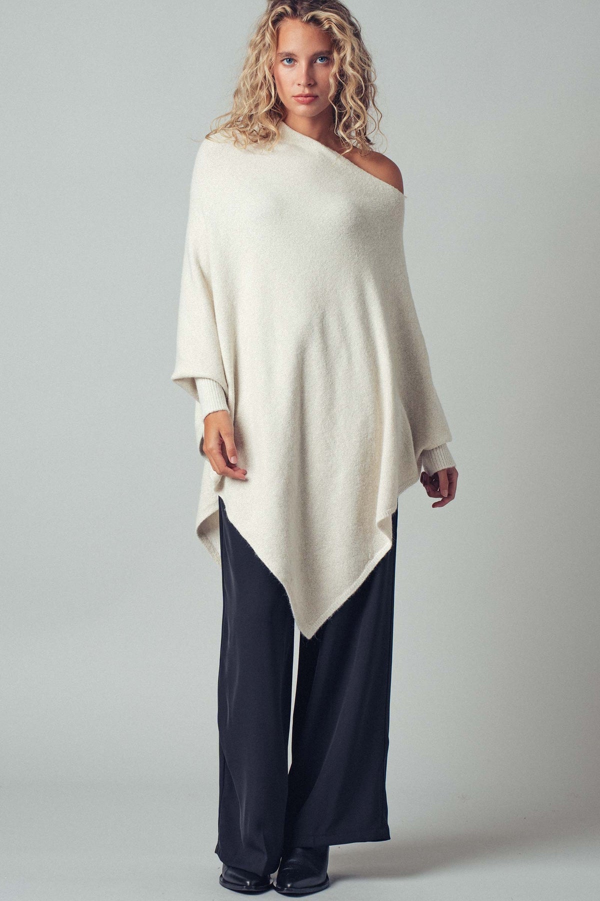 Asymmetrical Drape Knit Poncho Sweater in Ivory - Women's Capes & Ponchos | Urban Daizy