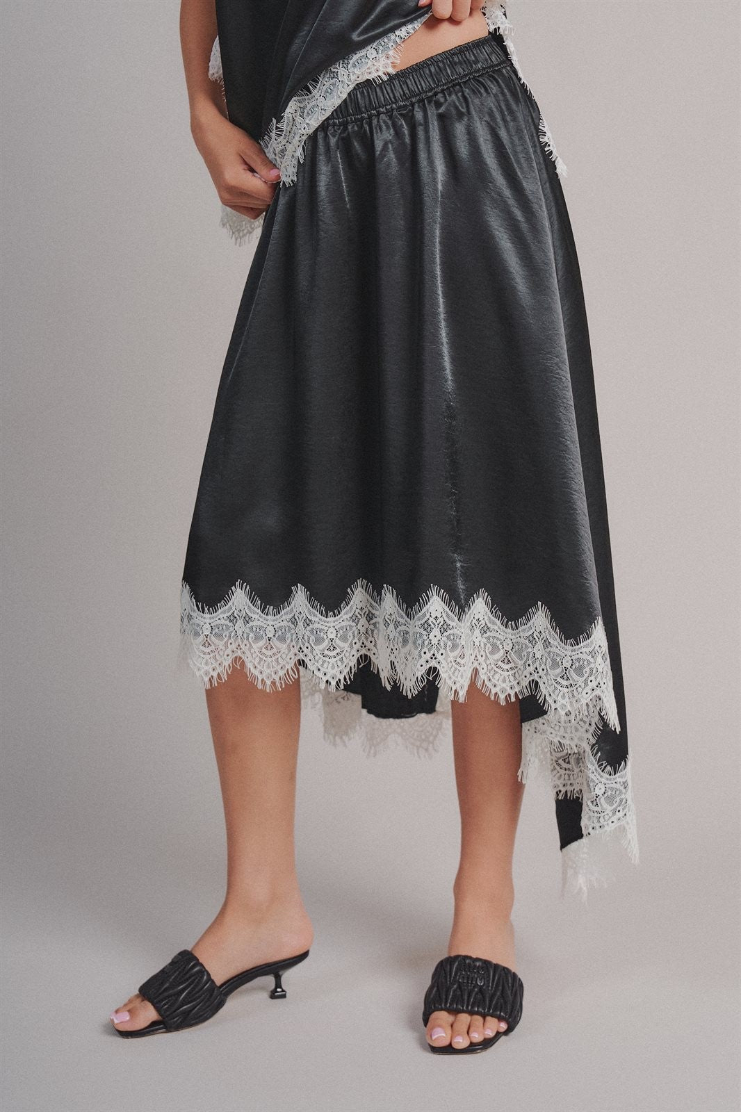 Lace Trim Satin Asymmetric Midi Skirt in Black - Women's Midi Skirts | Urban Daizy