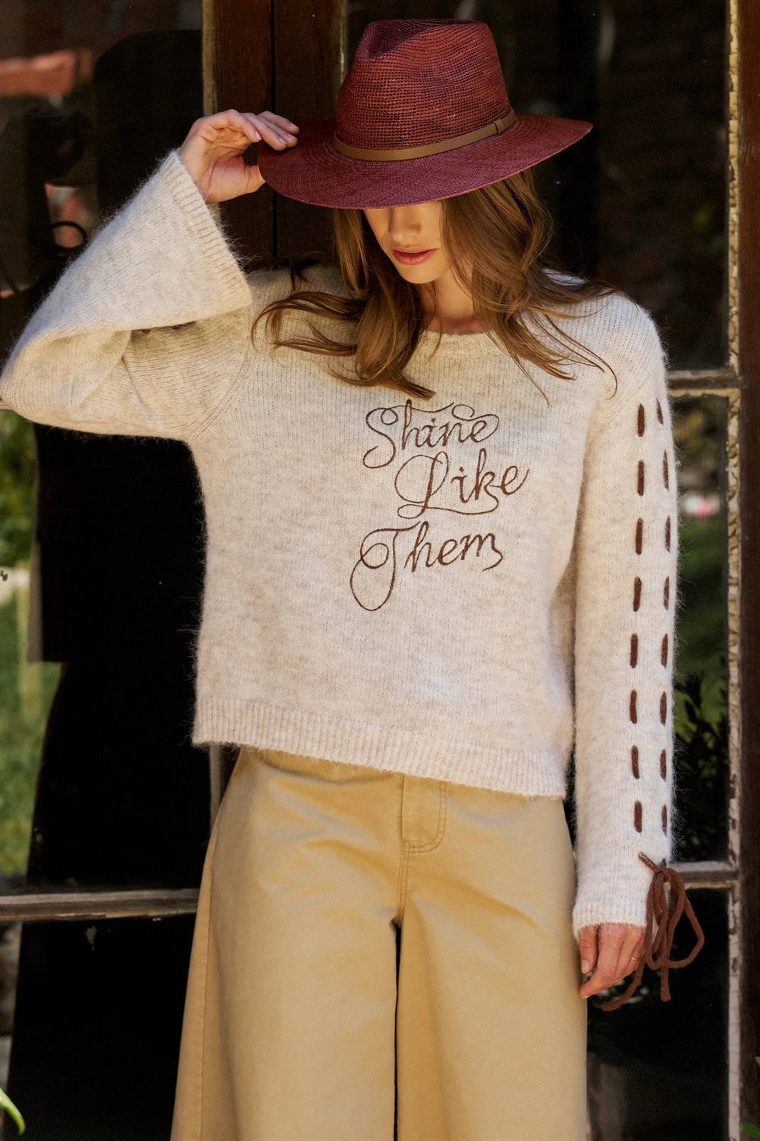 Slogan Embroidered Knit Sweater with Lace-Up Sleeves in Oatmeal - Women's Sweaters | Urban Daizy