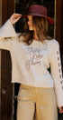 Slogan Embroidered Knit Sweater with Lace-Up Sleeves in Oatmeal - Women's Sweaters | Urban Daizy