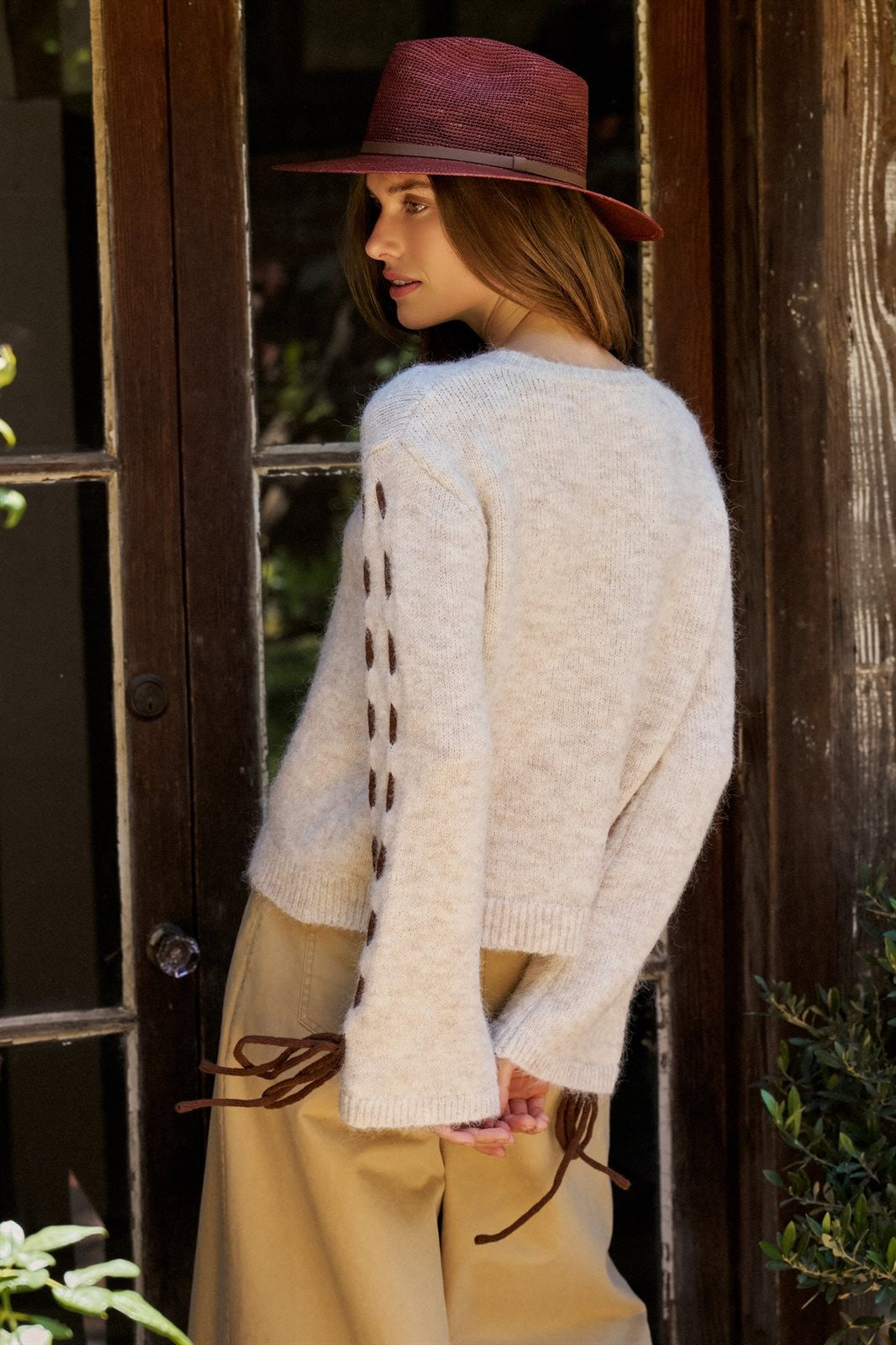 Slogan Embroidered Knit Sweater with Lace-Up Sleeves in Oatmeal - Women's Sweaters | Urban Daizy
